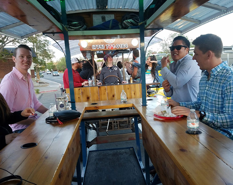 Corporate staff having fun together on the Reno Brew bike