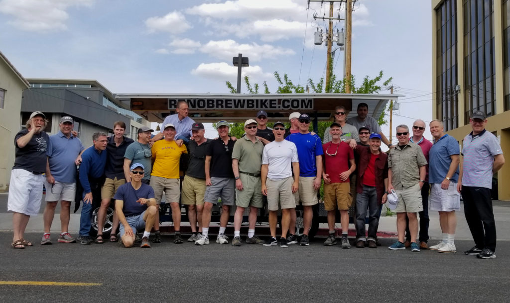 A large group gathered in front of one Brew Bike.