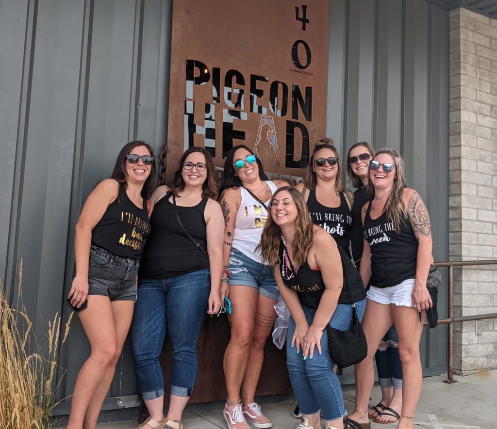 A Reno bachelorette party posing in front of Pigeon Head Brewery.