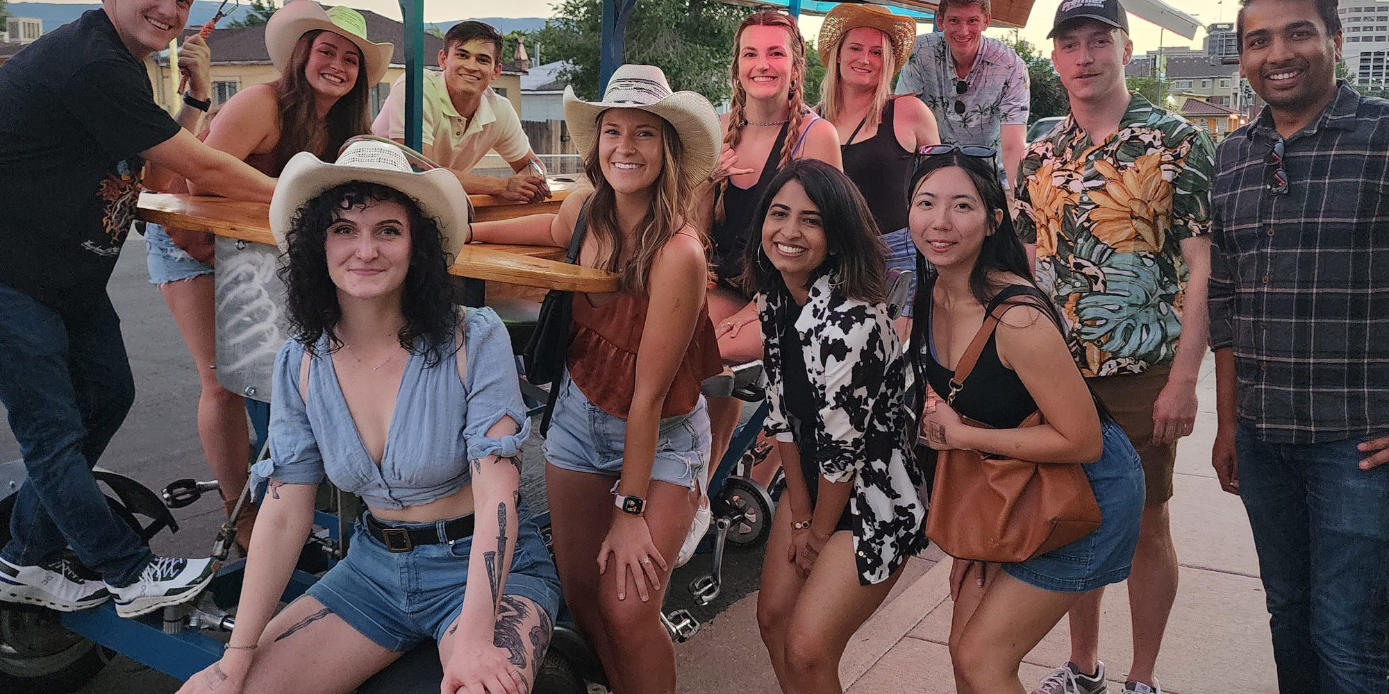 BrewBirthdayIdeas Reno birthday party posing in front of Reno Brew Bike
