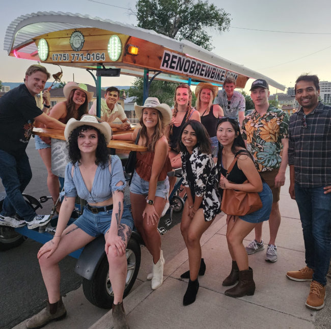 BrewBirthdayIdeas Reno birthday party posing in front of Reno Brew Bike