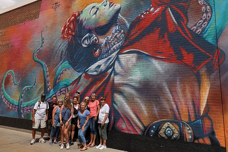 Non-drinking tour in front of Frida Kahlo mural